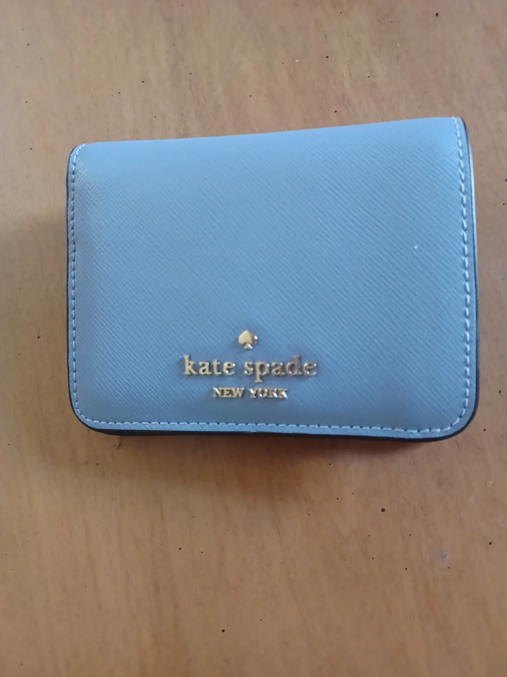 kate spade powder blue leather compact wallet with gold logo